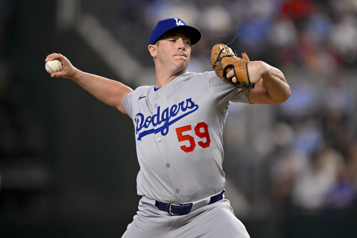 Apr 20, 2025; Arlington, Texas, USA; Los Angeles Dodgers relief pitcher Evan Phillips (59) pitches during the game between the Texas Rangers and the Los Angeles Dodgers at Globe Life Field. Mandatory Credit: Jerome Miron-Imagn Images