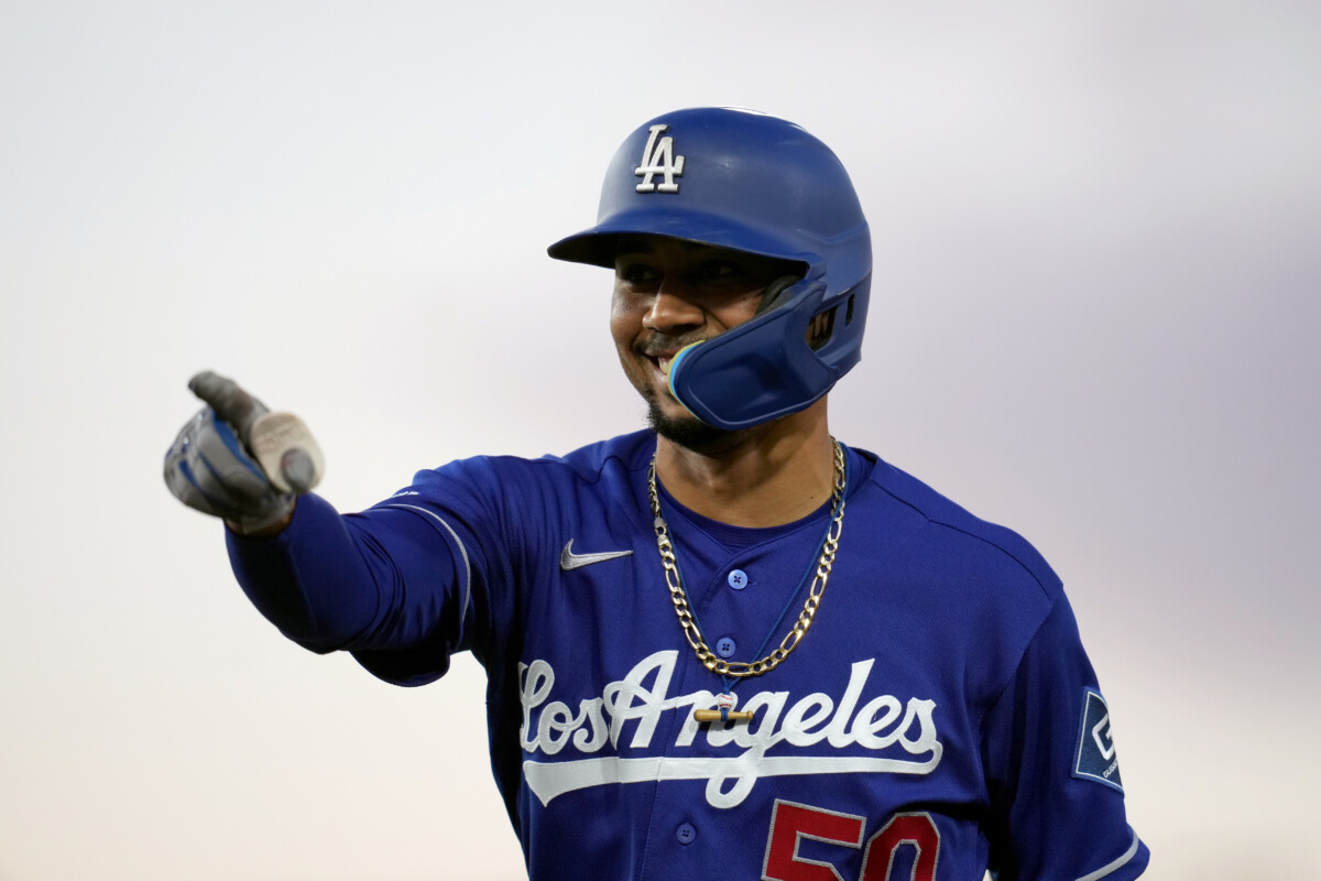 Jun 29, 2026; West Sacramento, California, USA; Los Angeles Dodgers shortstop Mookie Betts (50) points towards the dugout after hitting a single against the Athletics in the sixth inning at Sutter Health Park. Mandatory Credit: Cary Edmondson-Imagn Images