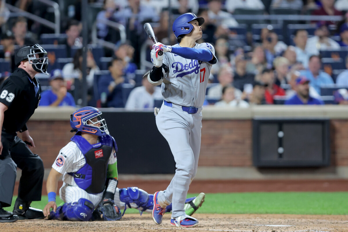 Jul 24, 2026; New York City, New York, USA; Los Angeles Dodgers designated hitter Shohei Ohtani (17) follows through on an RBI sacrifice fly against the New York Mets during the seventh inning at Citi Field. Mandatory Credit: Brad Penner-Imagn Images