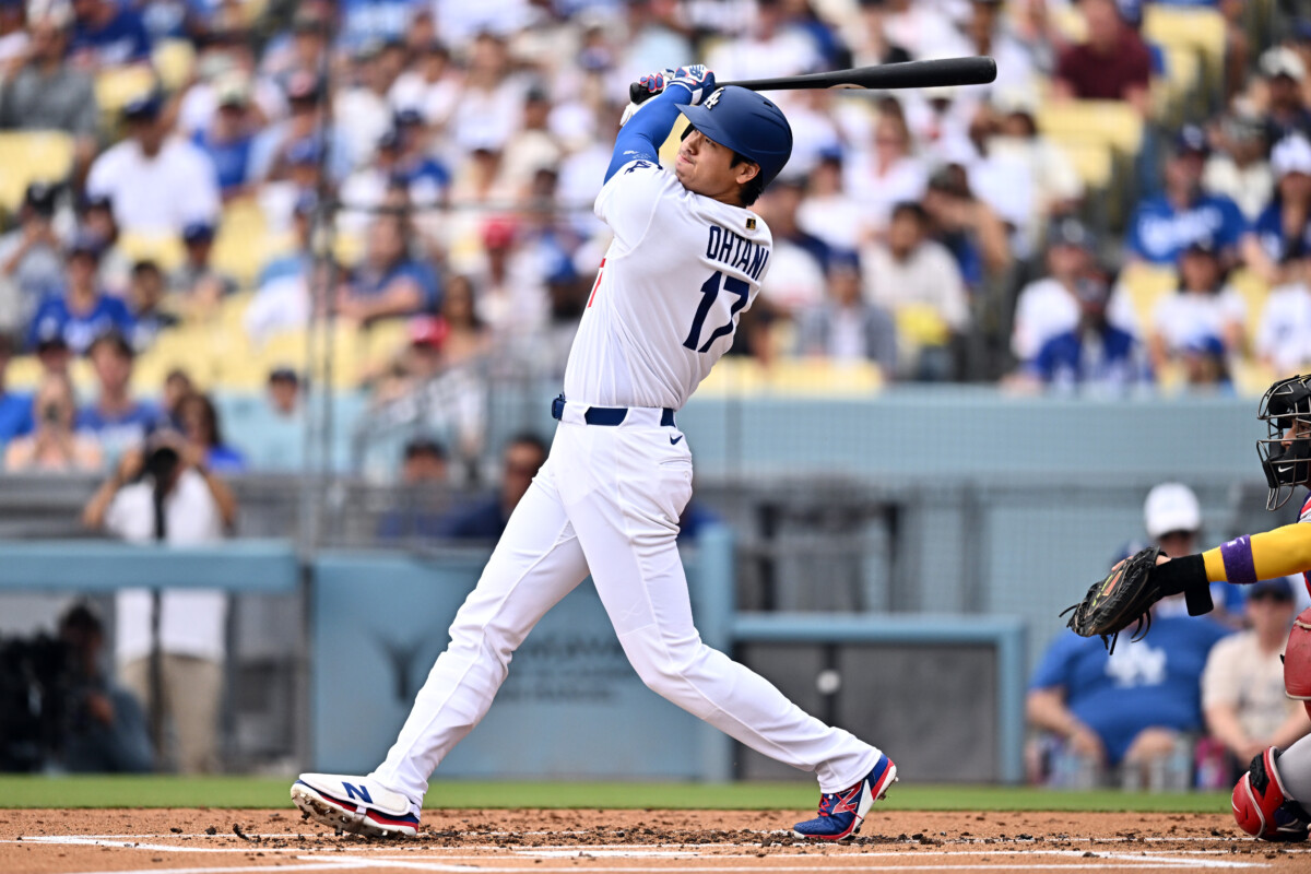Jul 12, 2026; Los Angeles, California, USA; Los Angeles Dodgers two-way player Shohei Ohtani (17) hits a solo home run against the Arizona Diamondbacks during the first inning at Dodger Stadium. Mandatory Credit: William Liang-Imagn Images