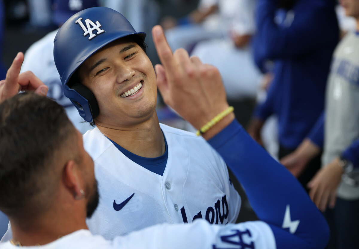 Jul 7, 2026; Los Angeles, California, USA; Los Angeles Dodgers designated hitter Shohei Ohtani (17) celebrates with teammates after hitting his 300th career home run during the first inning against the Colorado Rockies at Dodger Stadium. Mandatory Credit: Kiyoshi Mio-Imagn Images
