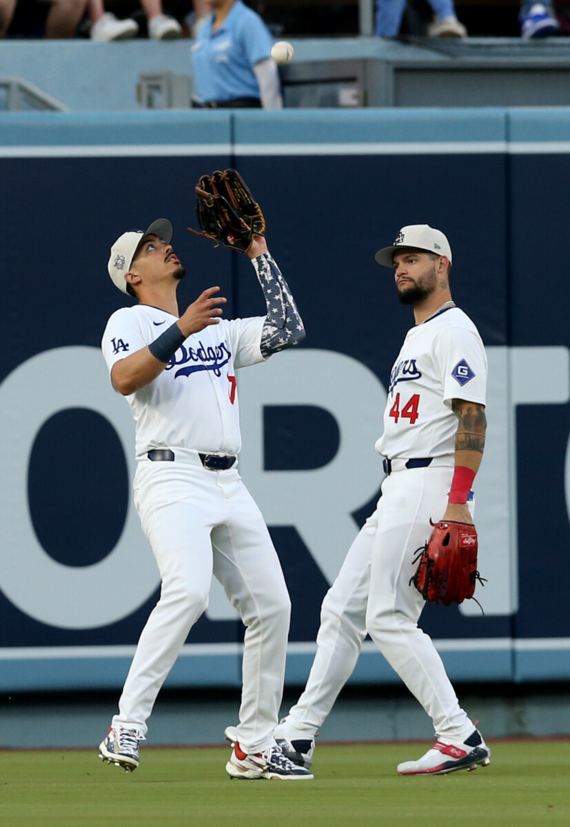 Jul 4, 2024; Los Angeles, California, USA; Los Angeles Dodgers outfielder Miguel Vargas (27) makes a catch in front of outfielder Andy Pages (44) during the fourth inning against the Arizona Diamondbacks at Dodger Stadium. Mandatory Credit: Jason Parkhurst-USA TODAY Sports