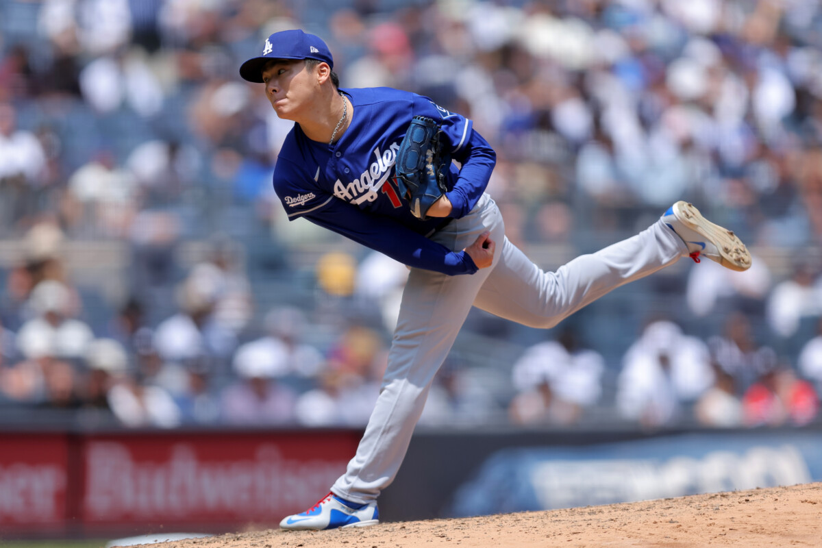 Jul 19, 2026; Bronx, New York, USA; Los Angeles Dodgers starting pitcher Yoshinobu Yamamoto (18) follows through on a pitch against the New York Yankees during the third inning at Yankee Stadium. Mandatory Credit: Brad Penner-Imagn Images