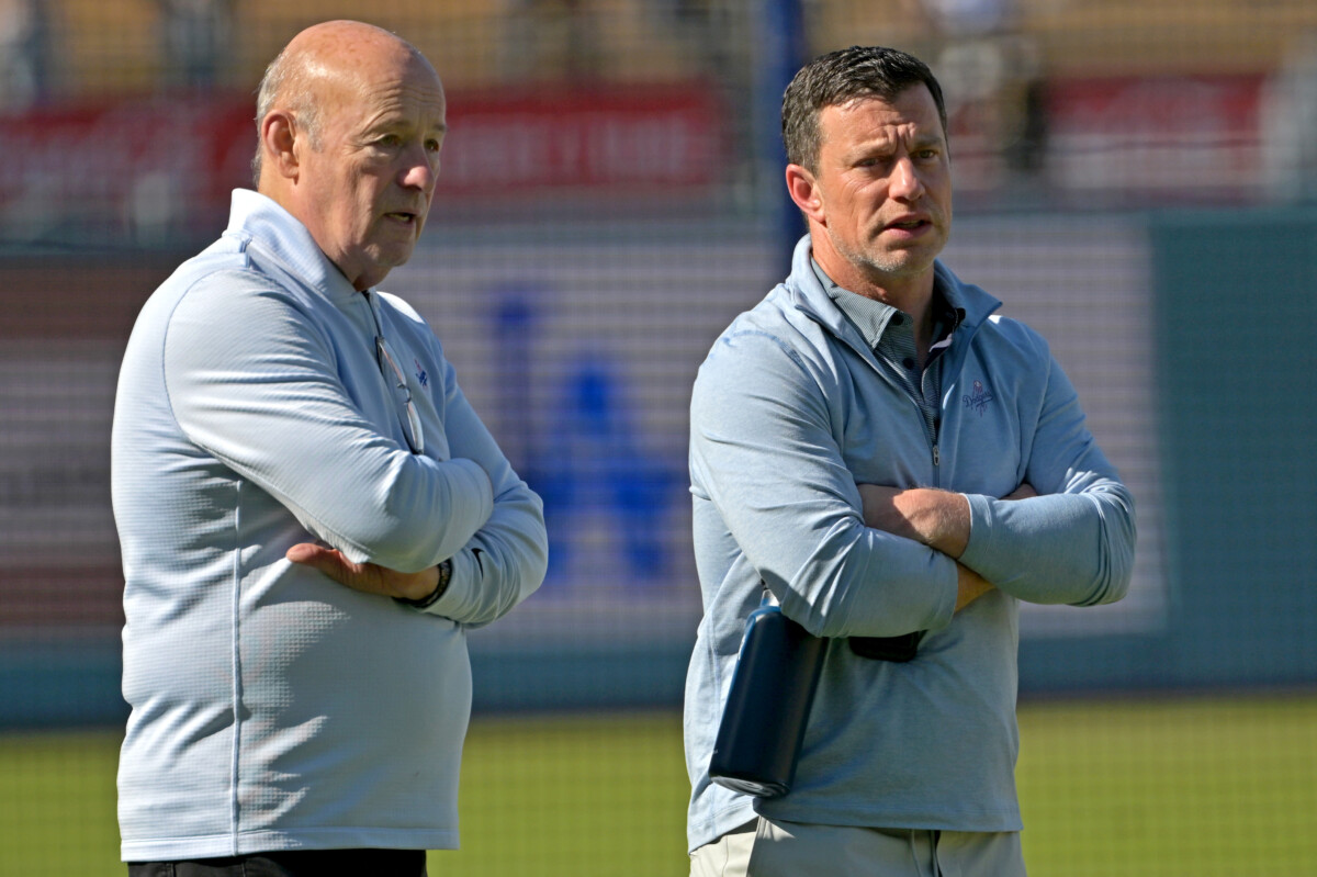 Apr 28, 2026; Los Angeles, California, USA; Los Angeles Dodgers President and CEO Stan Kasten talks with Andrew Friedman, President of Baseball Operations, prior to the game against the Miami Marlins at Dodger Stadium. Mandatory Credit: Jayne Kamin-Oncea-Imagn Images