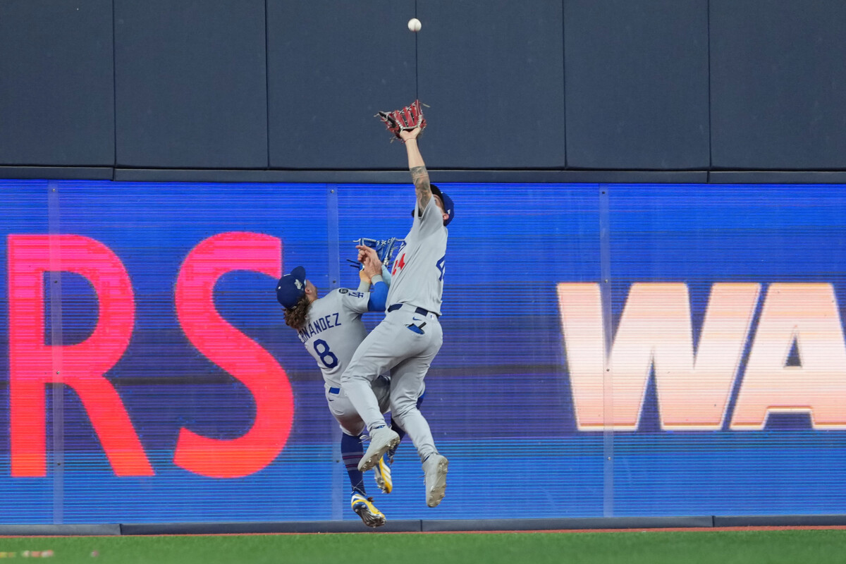 Nov 1, 2025; Toronto, Ontario, CAN; Los Angeles Dodgers center fielder Andy Pages (44) makes a catch against the Toronto Blue Jays in the ninth inning for game seven of the 2025 MLB World Series at Rogers Centre. Mandatory Credit: Nick Turchiaro-Imagn Images