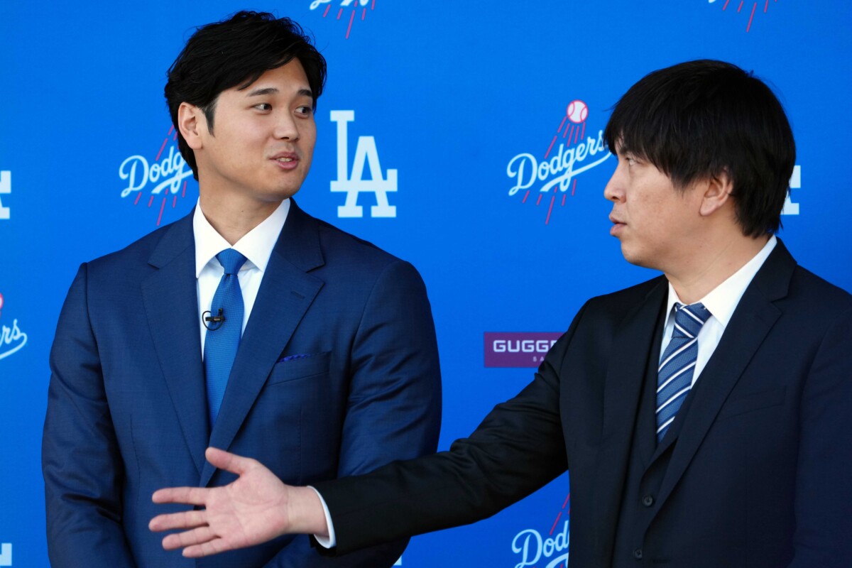 Dec 14, 2023; Los Angeles, CA, USA; Los Angeles Dodgers designated hitter Shohei Ohtan (left) speaks to interpreter Ippei Mizuhara at introductory press conference at Dodger Stadium. Mandatory Credit: Kirby Lee-USA TODAY Sports