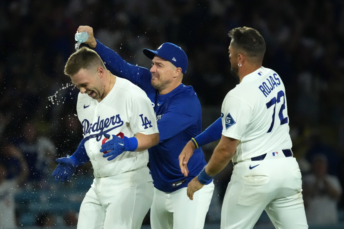 Jul 6, 2026; Los Angeles, California, USA; Los Angeles Dodgers catcher Dalton Rushing (68) celebrates with second baseman Miguel Rojas (72) and Kike Hernandez after hitting a walk-off single in the 11th inning against the Colorado Rockies at Dodger Stadium. Mandatory Credit: Kirby Lee-Imagn Images