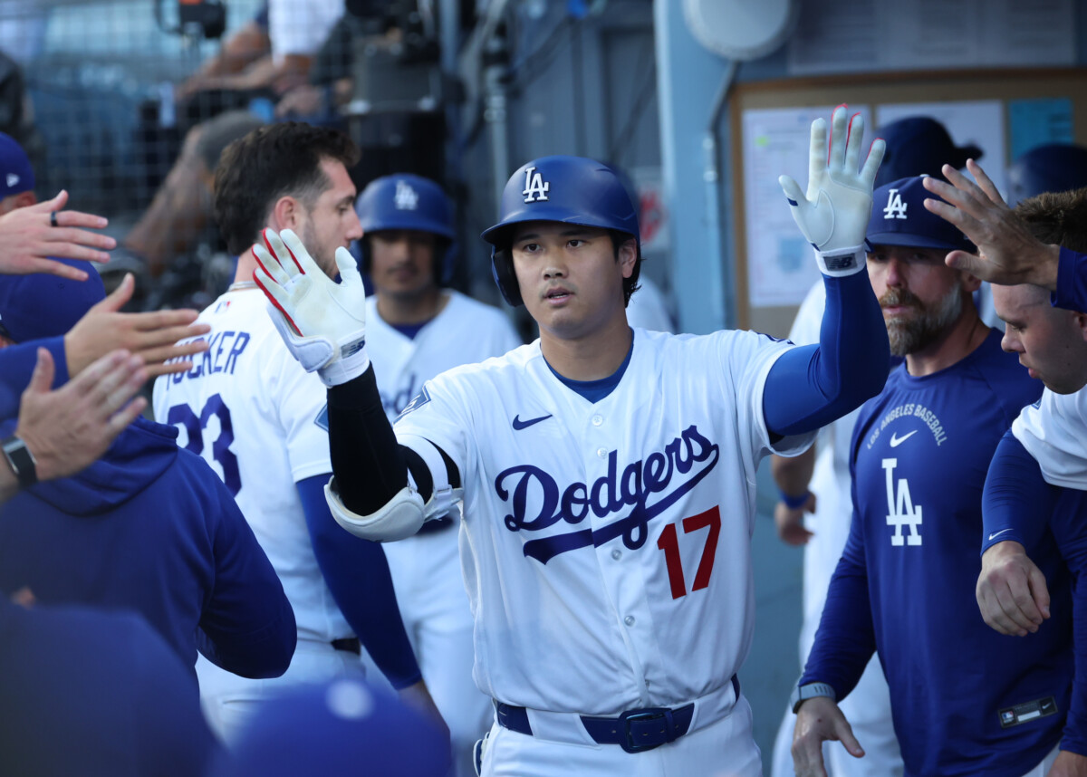 Jul 10, 2026; Los Angeles, California, USA; Los Angeles Dodgers designated hitter Shohei Ohtani (17) high-fives teammates after a home run during the first inning against the Arizona Diamondbacks at Dodger Stadium. Mandatory Credit: William Navarro-Imagn Images