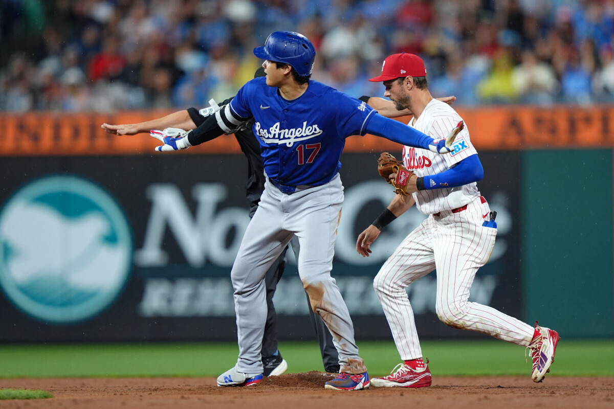 Jul 21, 2026; Philadelphia, Pennsylvania, USA; Los Angeles Dodgers designated hitter Shohei Ohtani (17) reacts after attempting to stretch a single at second against Philadelphia Phillies infielder Trea Turner (7) in the third inning at Citizens Bank Park. Mandatory Credit: Kyle Ross-Imagn Images
