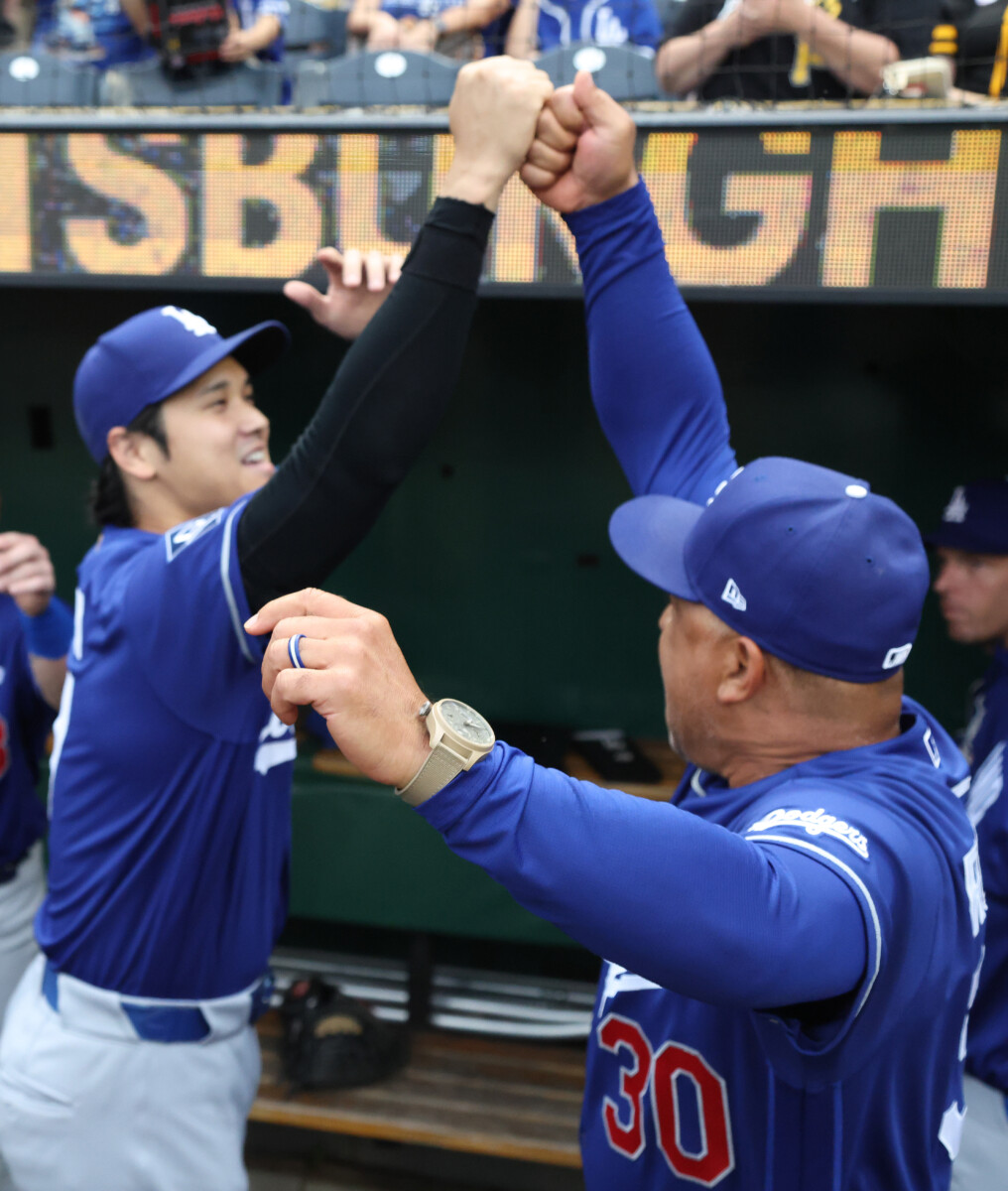 Jun 11, 2026; Pittsburgh, Pennsylvania, USA; Los Angeles Dodgers designated hitter Shohei Ohtani (left) and manager Dave Roberts (30) fist bump before the game against the.Pittsburgh Pirates at PNC Park. Mandatory Credit: Charles LeClaire-Imagn Images