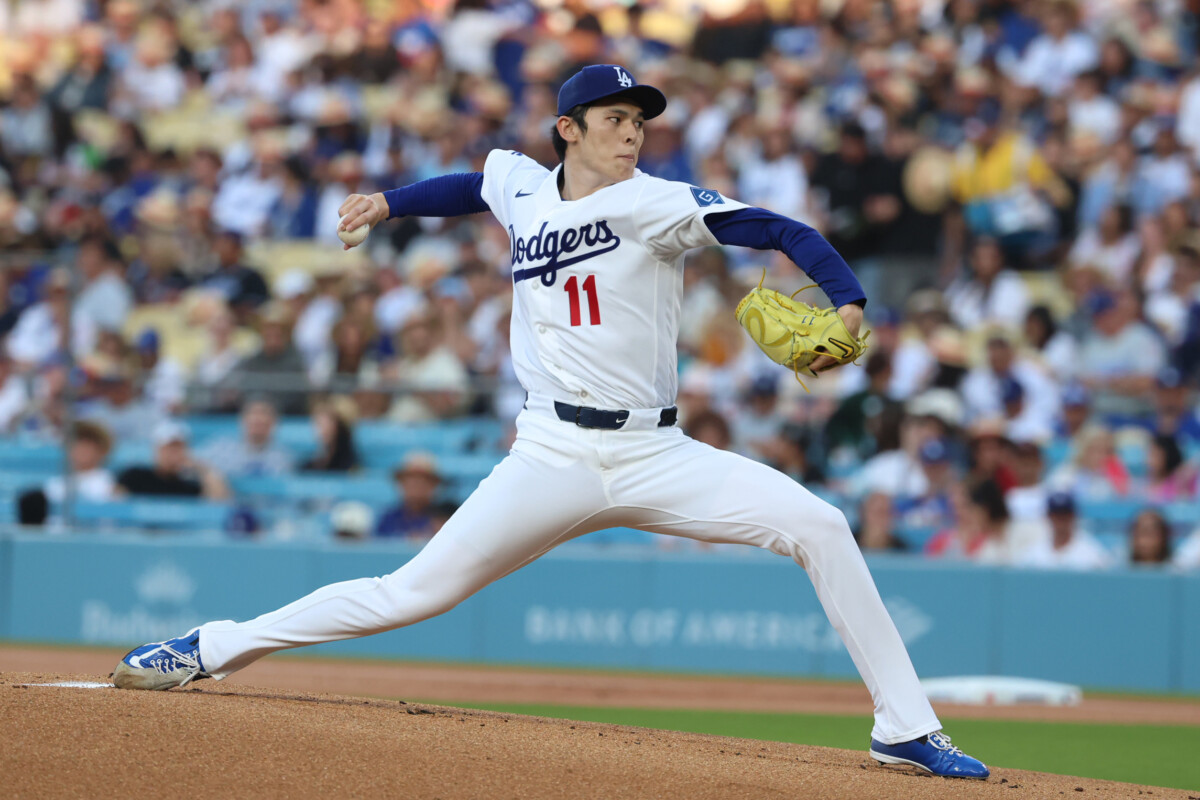Jul 2, 2026; Los Angeles, California, USA; Los Angeles Dodgers pitcher Roki Sasaki (11) pitches against the San Diego Padres in the first inning at Dodger Stadium. Mandatory Credit: William Navarro-Imagn Images