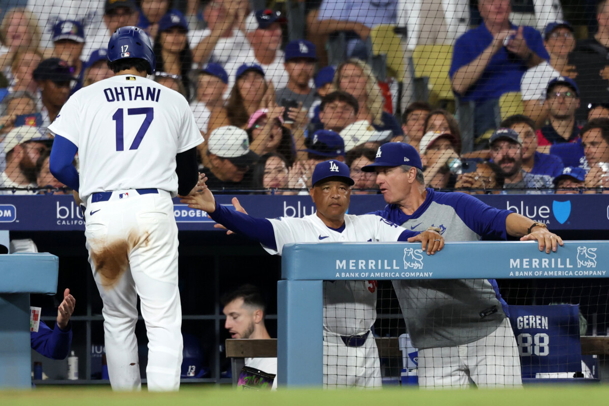 Jul 31, 2026; Los Angeles, California, USA; Los Angeles Dodgers designated hitter Shohei Ohtani (17) is greeted by manager Dave Roberts (30) after scoring a run during the fourth inning against the Boston Red Sox at Dodger Stadium. Mandatory Credit: Kiyoshi Mio-Imagn Images