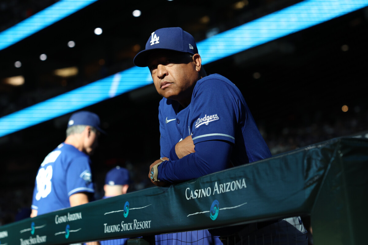 Aug 8, 2026; Phoenix, Arizona, USA; Los Angeles Dodgers manager Dave Roberts (4) looks out to the field before the game against the Arizona Diamondbacks at Chase Field. Mandatory Credit: Anna Carrington-Imagn Images