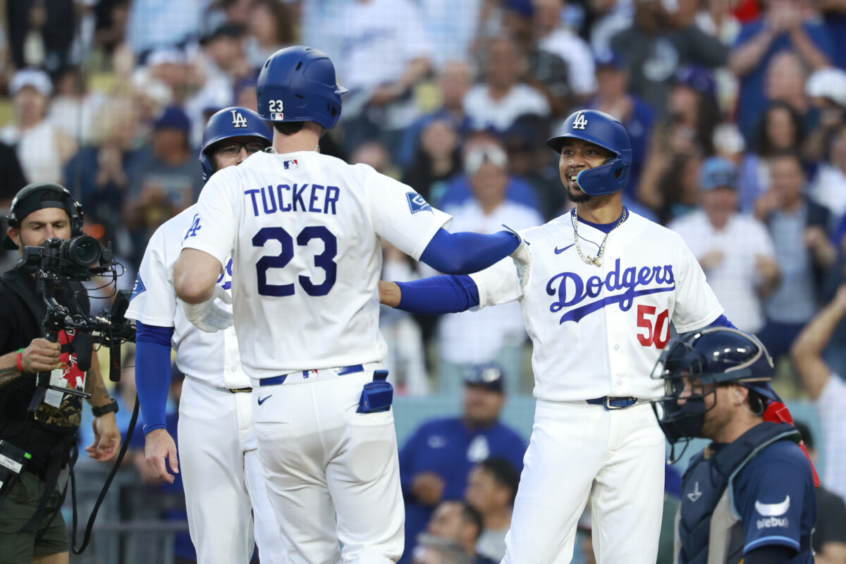 Jun 15, 2026; Los Angeles, California, USA; Los Angeles Dodgers right fielder Kyle Tucker (23) celebrates with shortstop Mookie Betts (50) and third baseman Max Muncy (13) after hitting a three-run home run in the second inning against the Tampa Bay Rays at Dodger Stadium. Mandatory Credit: William Navarro-Imagn Images