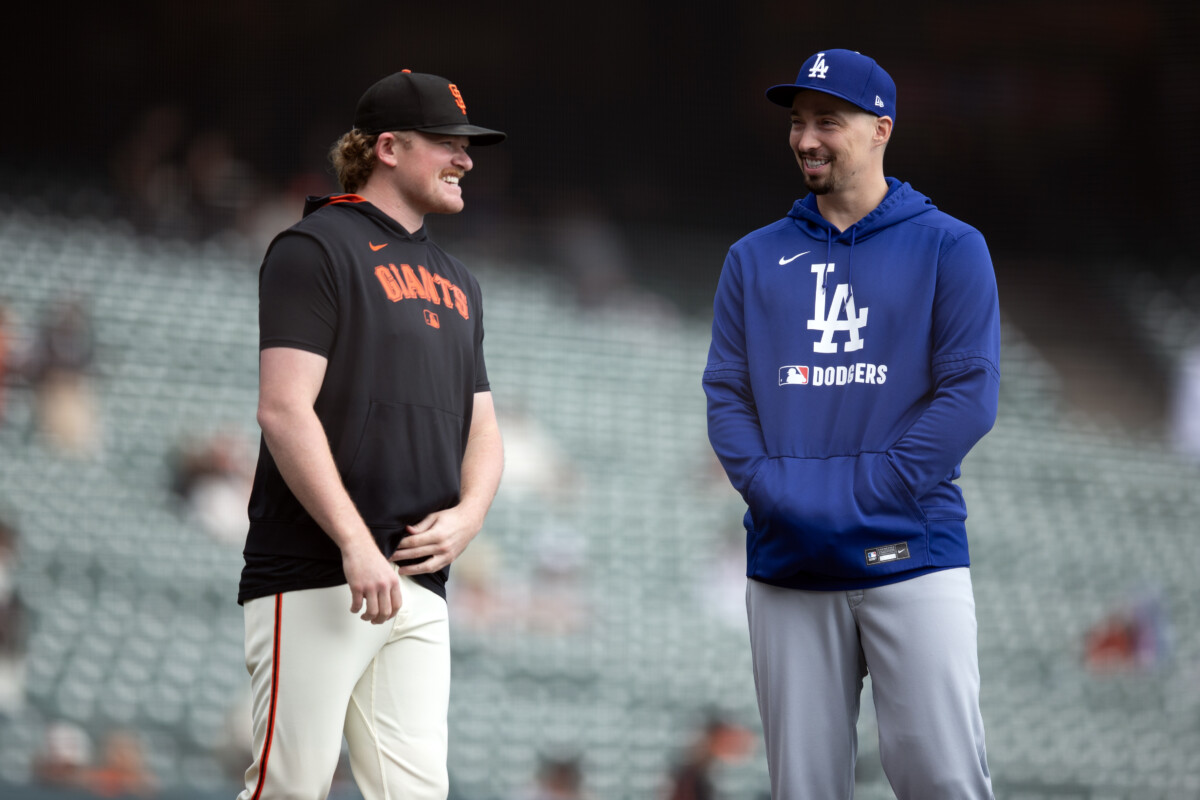 Sep 14, 2025; San Francisco, California, USA; Former teammates, San Francisco Giants pitcher Logan Webb (left) and Los Angeles Dodgers pitcher Blake Snell chat before the teams meet at Oracle Park. Mandatory Credit: D. Ross Cameron-Imagn Images