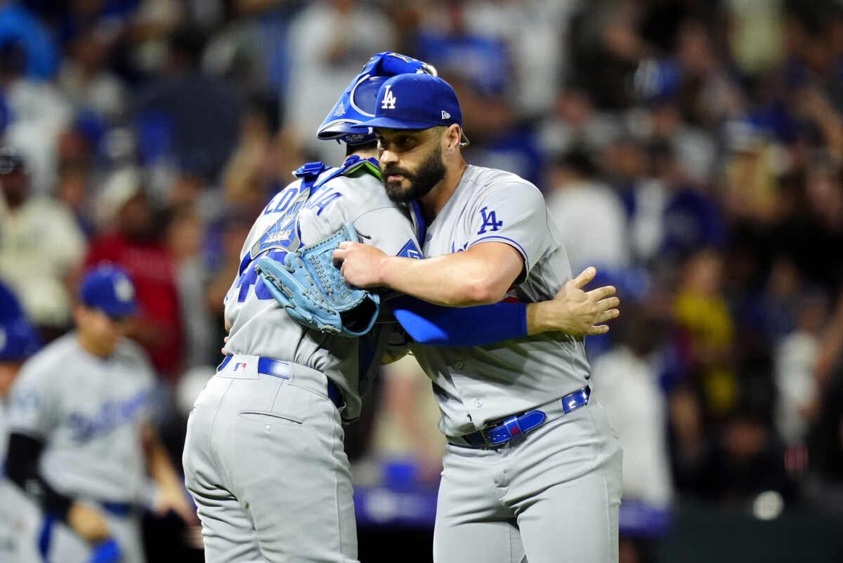 Aug 19, 2026; Denver, Colorado, USA; Los Angeles Dodgers relief pitcher Tanner Scott (66) and catcher Ben Rortvedt (47) celebrate the tenth inning win against the Colorado Rockies at Coors Field. Mandatory Credit: Ron Chenoy-Imagn Images