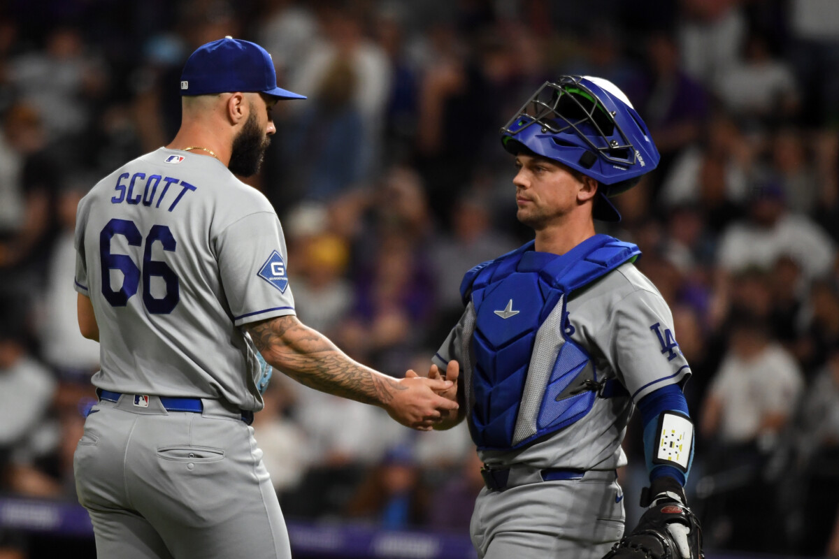 Aug 18, 2026; Denver, Colorado, USA; Los Angeles Dodgers pitcher Tanner Scott (66) and catcher Hunter Feduccia (46) after a win against the Colorado Rockies at Coors Field. Mandatory Credit: Christopher Hanewinckel-Imagn Images