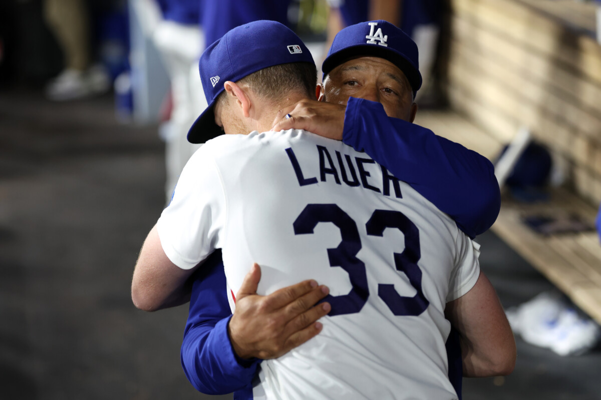 Aug 12, 2026; Los Angeles, California, USA; Los Angeles Dodgers pitcher Eric Lauer (33) hugs with manager Dave Roberts (30) after being removed from the game during the seventh inning against the Kansas City Royals at Dodger Stadium. Mandatory Credit: Kiyoshi Mio-Imagn Images