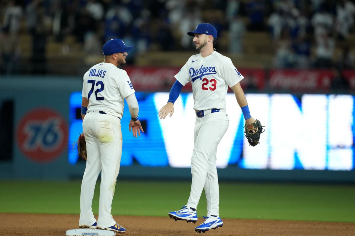 May 14, 2026; Los Angeles, California, USA; Los Angeles Dodgers right fielder Kyle Tucker (23) and shortstop Miguel Rojas (72) celebrate after defeating the San Francisco Giants at Dodger Stadium. Mandatory Credit: Kirby Lee-Imagn Images