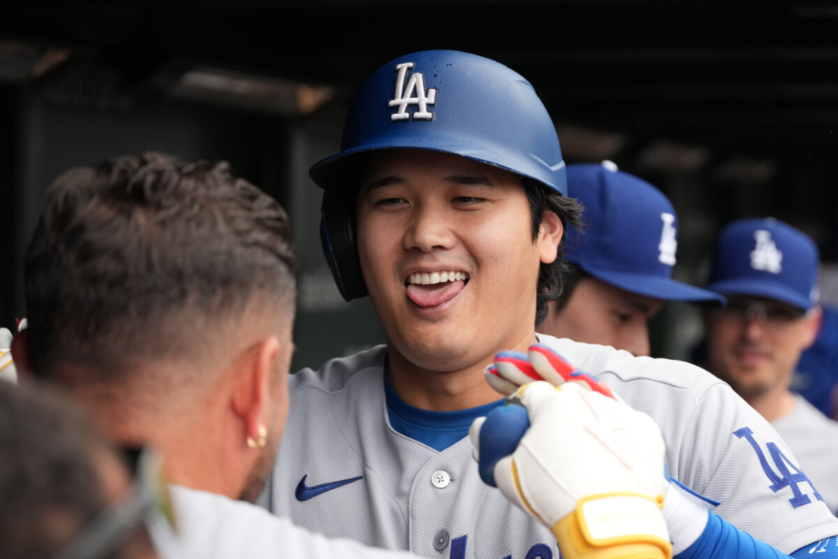 Aug 5, 2026; Chicago, Illinois, USA; Los Angeles Dodgers two-way player Shohei Ohtani (17) is greeted in the dugout after hitting a home run against the Chicago Cubs during the first inning at Wrigley Field. Mandatory Credit: David Banks-Imagn Images