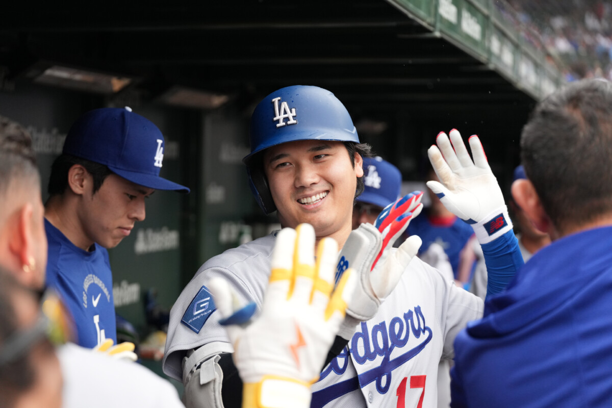 Aug 5, 2026; Chicago, Illinois, USA; Los Angeles Dodgers two-way player Shohei Ohtani (17) is greeted in the dugout after hitting a home run against the Chicago Cubs during the first inning at Wrigley Field. Mandatory Credit: David Banks-Imagn Images