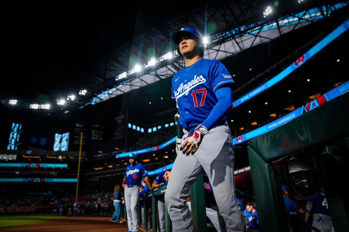 Dodgers designated hitter Shohei Ohtani (17) walks out of the dugout prior to a game against the Diamondbacks at Chase Field in Phoenix, on August 8, 2026.