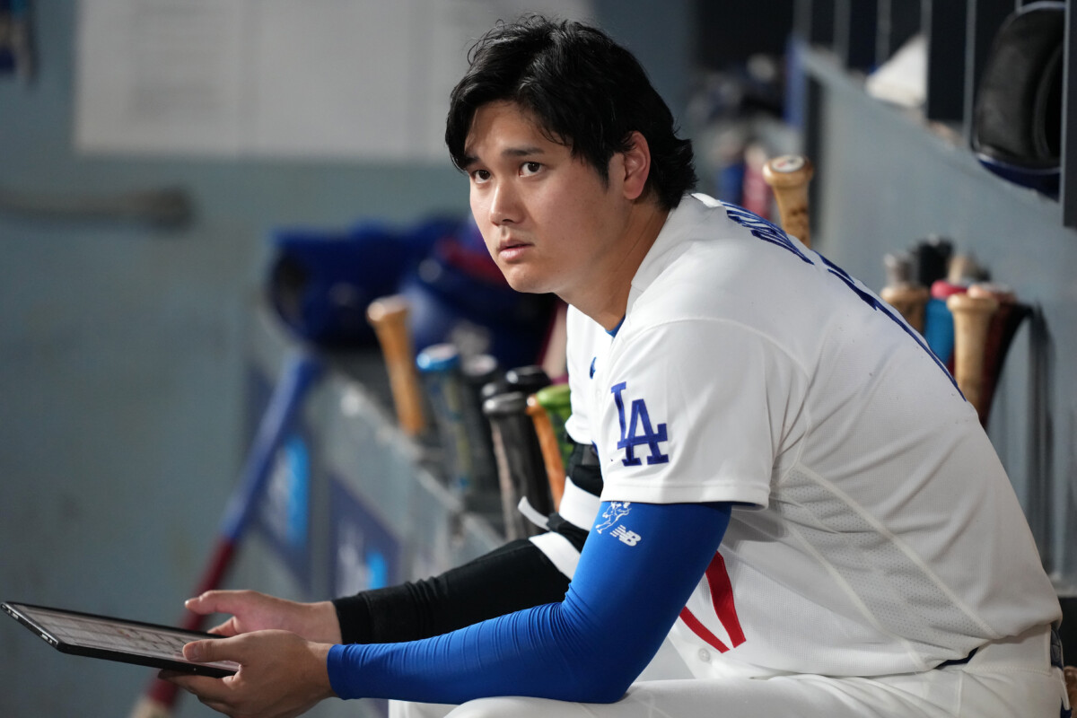 Aug 21, 2026; Los Angeles, California, USA; Los Angeles Dodgers designated hitter Shohei Ohtani (17) looks on in the dugout during the fifth inning against the Pittsburgh Pirates at Dodger Stadium. Mandatory Credit: Kirby Lee-Imagn Images