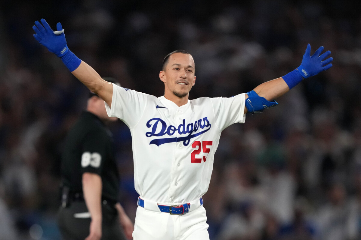 Aug 21, 2026; Los Angeles, California, USA; Los Angeles Dodgers second baseman Tommy Edman (25) celebrates after hitting a walk-off single in the 10th inning against the Pittsburgh Pirates at Dodger Stadium. Mandatory Credit: Kirby Lee-Imagn Images