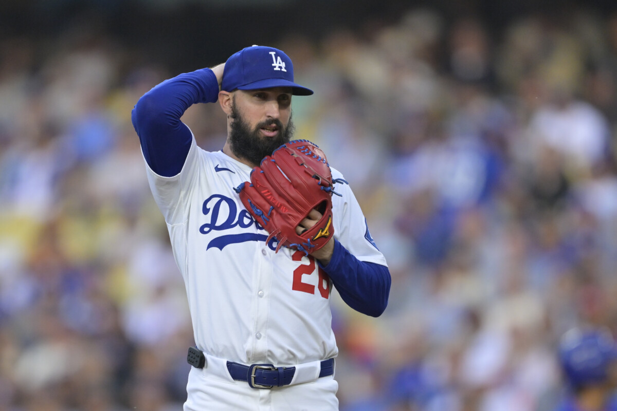 Jun 4, 2025; Los Angeles, California, USA; Los Angeles Dodgers pitcher Tony Gonsolin (26) reacts to hitting New York Mets shortstop Francisco Lindor (12) (not pictured) during the first inning at Dodger Stadium. Mandatory Credit: Jayne Kamin-Oncea-Imagn Images