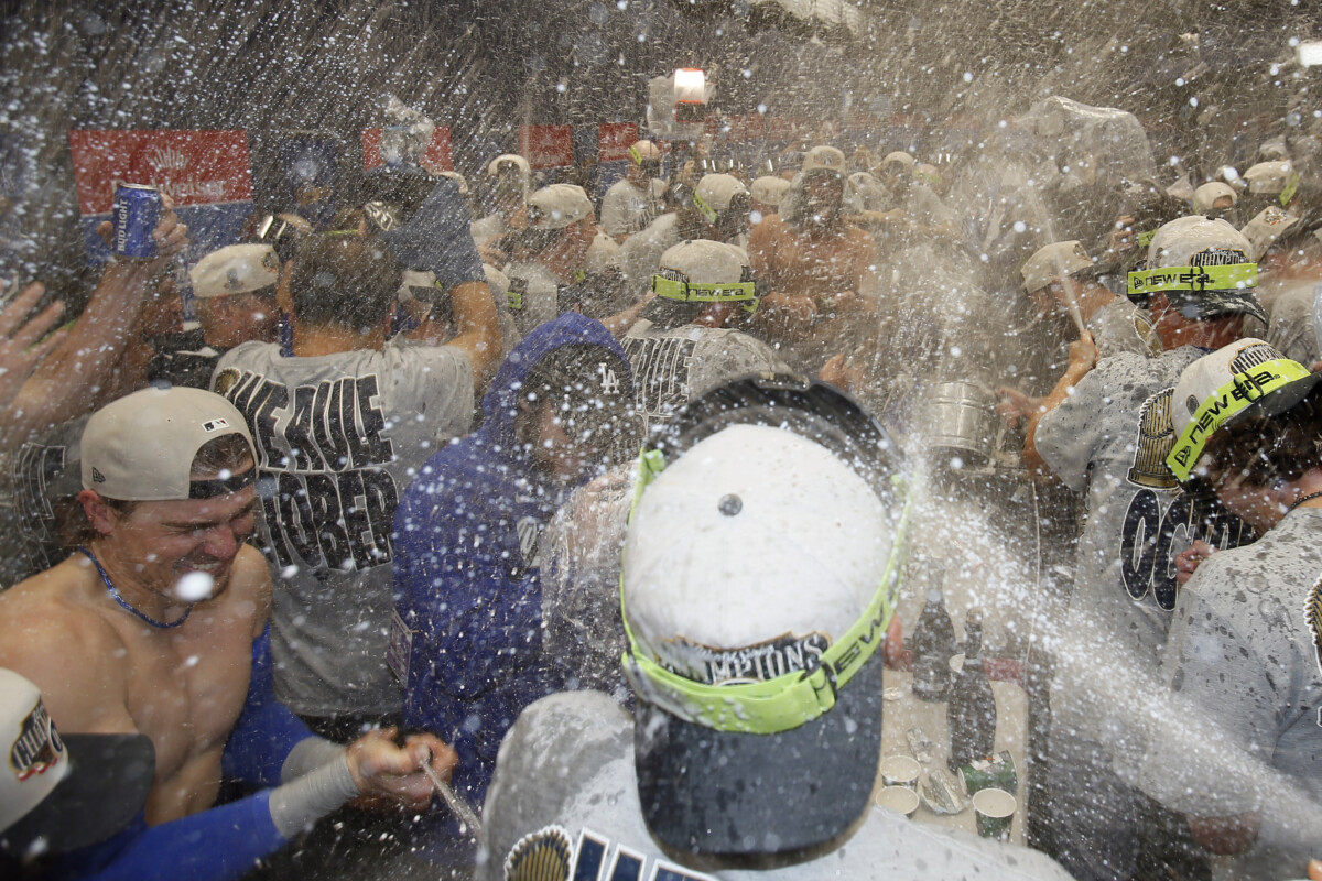 Oct 31, 2025; Toronto, Ontario, CAN; Los Angeles Dodgers celebrate with champagne in the locker room after defeating the Toronto Blue Jays in the 2025 MLB World Series at Rogers Centre. Mandatory Credit: John E. Sokolowski-Imagn Images