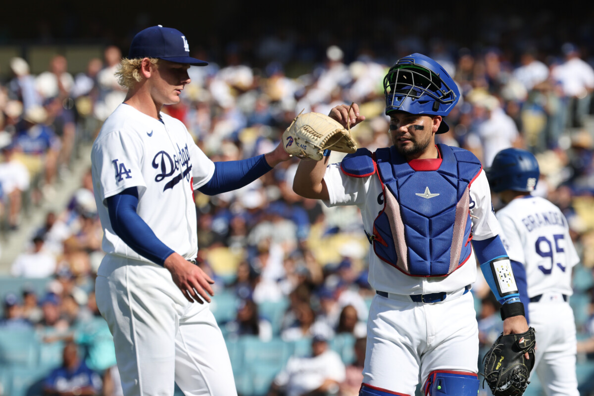 Jul 5, 2026; Los Angeles, California, USA; Los Angeles Dodgers pitcher Emmet Sheehan (80) and catcher Eliézer Alfonzo (64) walk off the field at the end of the second inning at Dodger Stadium. Mandatory Credit: Kiyoshi Mio-Imagn Images