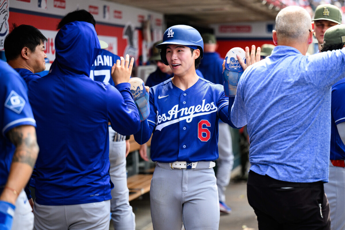 May 17, 2026; Anaheim, California, USA; Los Angeles Dodgers second baseman Hyeseong Kim (6) is greeted by teammates after scoring during the ninth inning against the Los Angeles Angels at Angel Stadium. Mandatory Credit: William Liang-Imagn Images