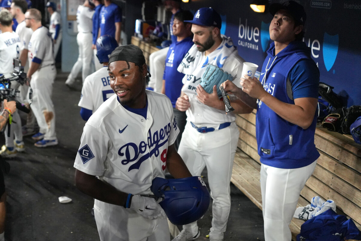 Sep 18, 2026; Los Angeles, California, USA; Los Angeles Dodgers designated hitter Josue de Paula (95) reacts after scoring in the eighth inning as Shohei Ohtani (right) watches against the San Francisco Giants at Dodger Stadium. Mandatory Credit: Kirby Lee-Imagn Images