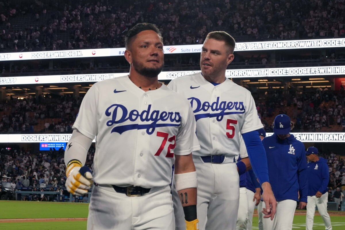 Aug 14, 2026; Los Angeles, California, USA; Los Angeles Dodgers second baseman Miguel Rojas (72) and first baseman Freddie Freeman (5) react after the game against the Milwaukee Brewers at Dodger Stadium. Mandatory Credit: Kirby Lee-Imagn Images