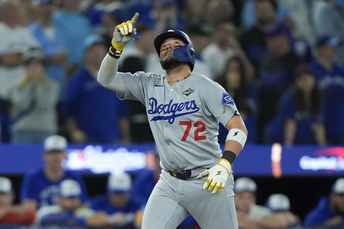 Nov 1, 2025; Toronto, Ontario, CAN; Los Angeles Dodgers second baseman Miguel Rojas (72) celebrates as he runs the bases after hitting a home run against the Toronto Blue Jays in the ninth inning during game seven of the 2025 MLB World Series at Rogers Centre. Mandatory Credit: John E. Sokolowski-Imagn Images