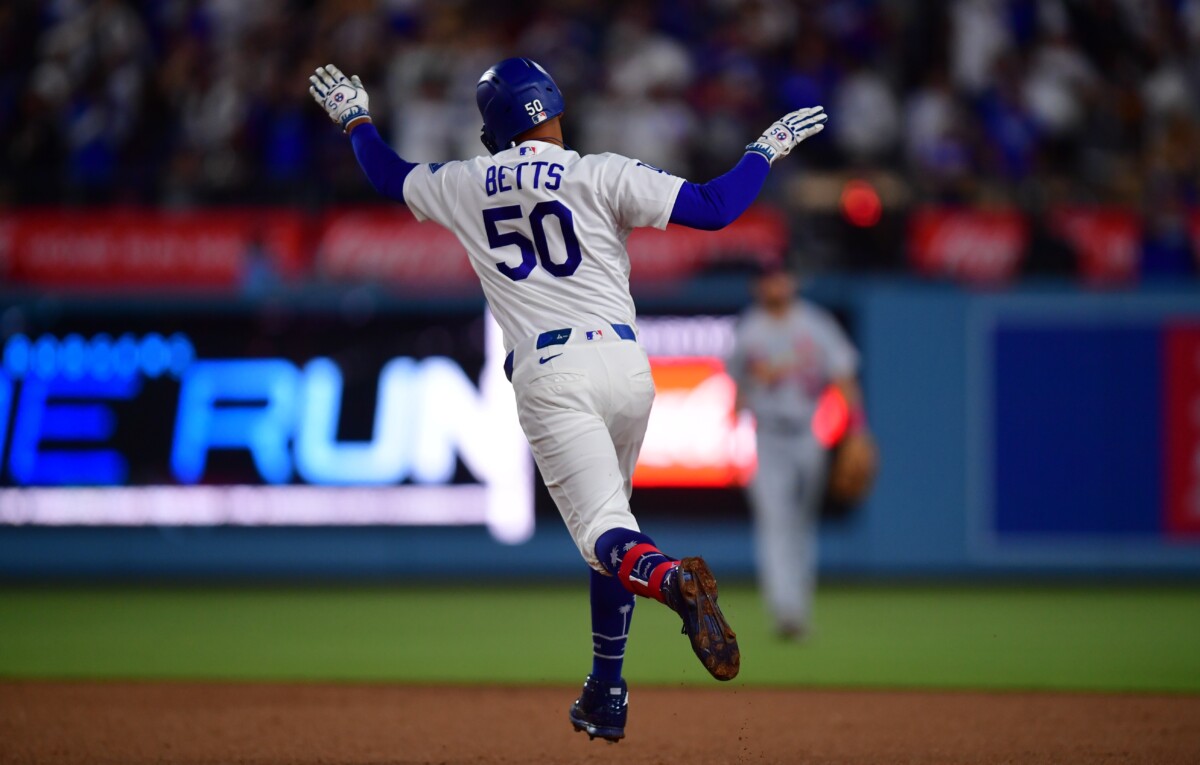 Sep 2, 2026; Los Angeles, California, USA; Los Angeles Dodgers shortstop Mookie Betts (50) hits 2 run home run during the sixth inning against the St. Louis Cardinals at UNIQLO Field at Dodger Stadium. Mandatory Credit: Gary A. Vasquez-Imagn Images