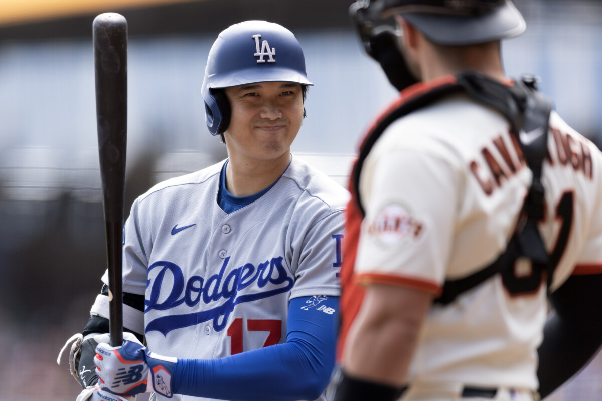 Sep 27, 2026; San Francisco, California, USA; Los Angeles Dodgers designated hitter Shohei Ohtani (17) greets San Francisco Giants catcher Drew Cavanaugh (61) as he steps in to bat during the first inning at Oracle Park. Mandatory Credit: D. Ross Cameron-Imagn Images