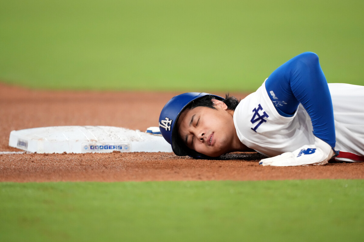 Sep 1, 2026; Los Angeles, California, USA; Los Angeles Dodgers pitcher Shohei Ohtani (17) slides into third base during the fifth inning against the St. Louis Cardinals at Dodger Stadium. Mandatory Credit: Kirby Lee-Imagn Images
