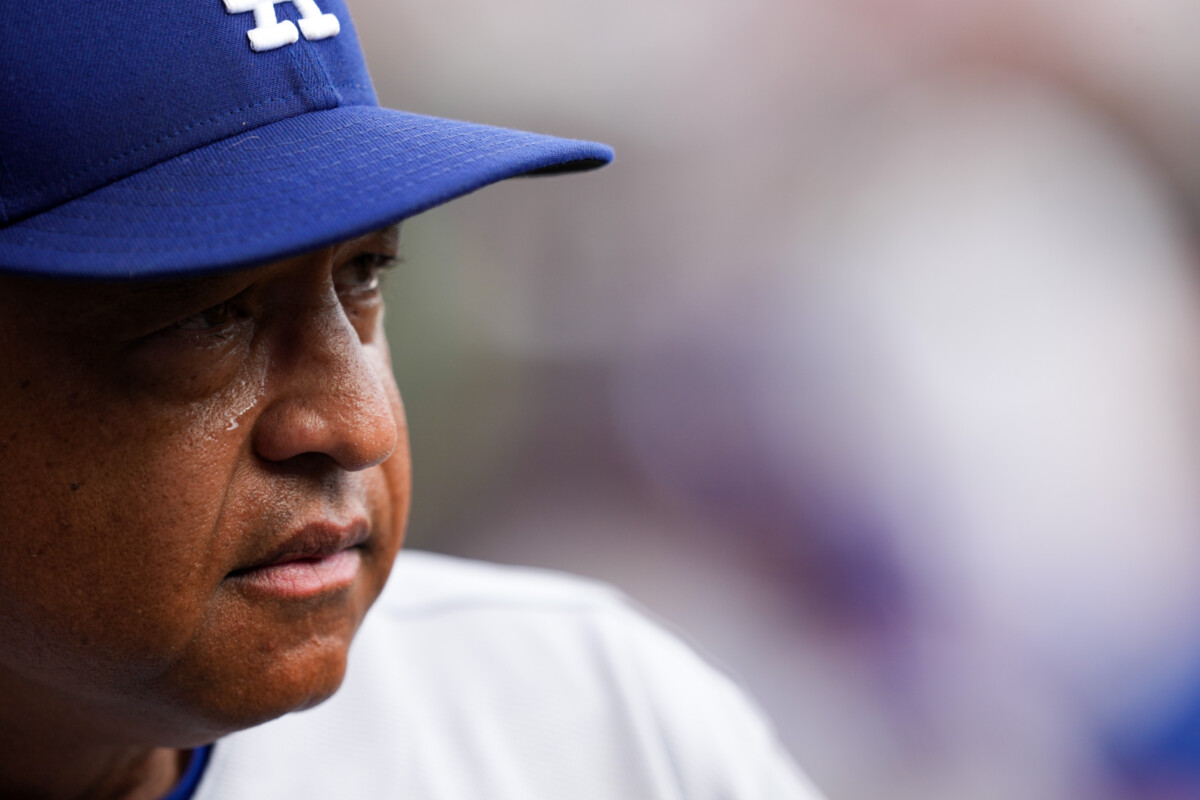 Sep 17, 2026; Cincinnati, Ohio, USA; Los Angeles Dodgers manager Dave Roberts looks out from the dugout during the game against the Cincinnati Reds in the ninth inning at Great American Ball Park. Mandatory Credit: Aaron Doster-Imagn Images