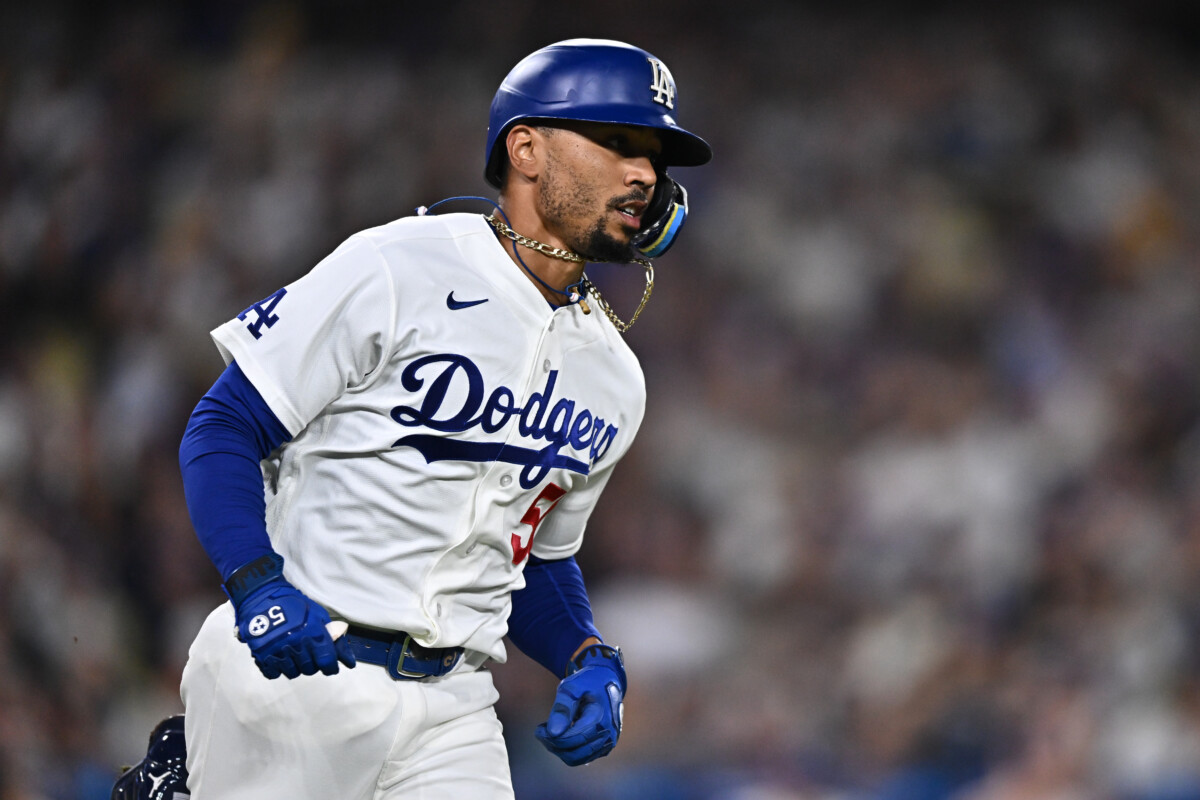 Sep 24, 2026; Los Angeles, California, USA; Los Angeles Dodgers shortstop Mookie Betts (50) runs after hitting a single during the fifth inning against the San Diego Padres at Dodger Stadium. Mandatory Credit: William Liang-Imagn Images