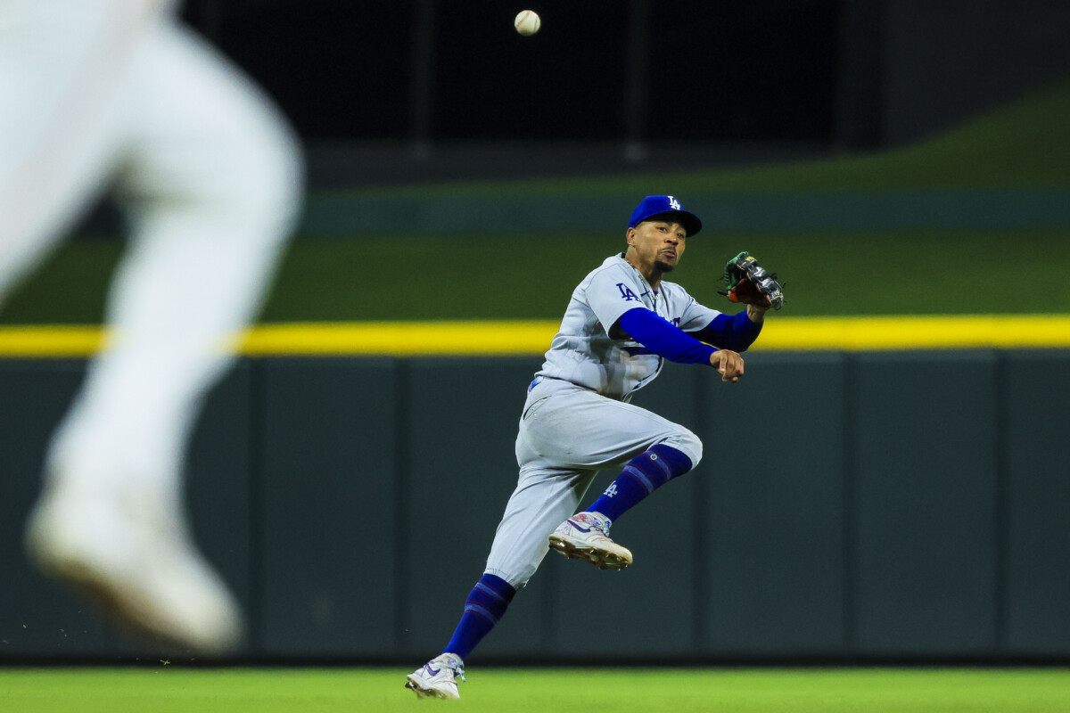 Sep 16, 2026; Cincinnati, Ohio, USA; Los Angeles Dodgers shortstop Mookie Betts (50) throws to first in attempt to get Cincinnati Reds outfielder JJ Bleday (not pictured) out in the eighth inning at Great American Ball Park. Mandatory Credit: Katie Stratman-Imagn Images