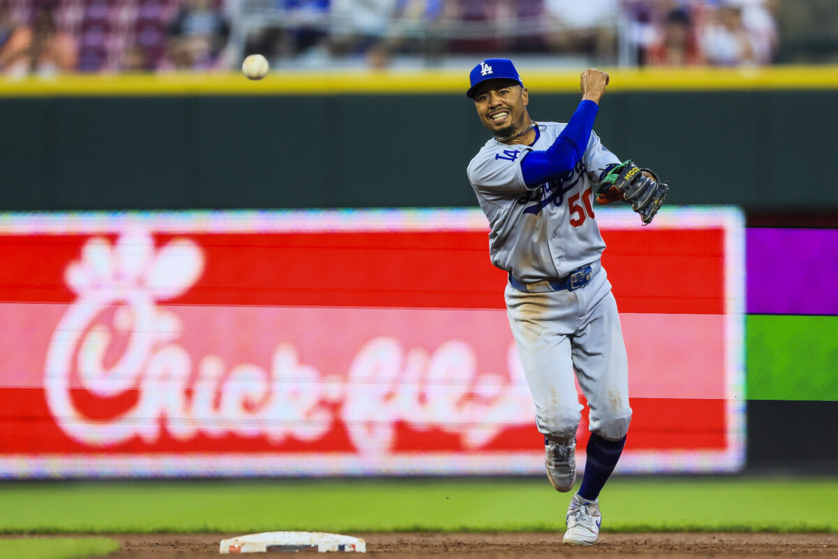 Sep 16, 2026; Cincinnati, Ohio, USA; Los Angeles Dodgers shortstop Mookie Betts (50) throws to first to get Cincinnati Reds outfielder Dane Myers (not pictured) out in the third inning at Great American Ball Park. Mandatory Credit: Katie Stratman-Imagn Images