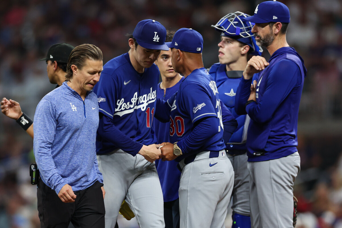 Aug 26, 2026; Cumberland, Georgia, USA; Los Angeles Dodgers starting pitcher Roki Sasaki (11) exits the game against the Atlanta Braves in the fourth inning at Truist Park. Mandatory Credit: Colin Hubbard-Imagn Images