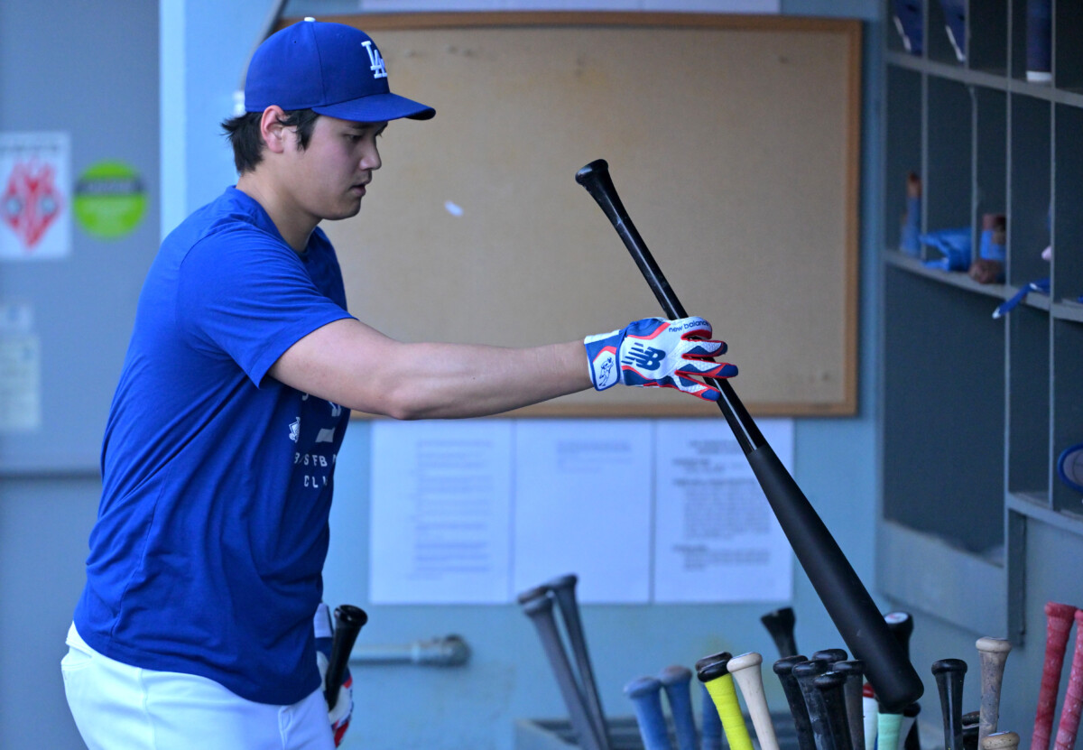 May 11, 2026; Los Angeles, California, USA; Los Angeles Dodgers two-way player Shohei Ohtani (17) puts his bats in the rack after taking live batting practice prior to the game against the San Francisco Giants at Dodger Stadium. Mandatory Credit: Jayne Kamin-Oncea-Imagn Images