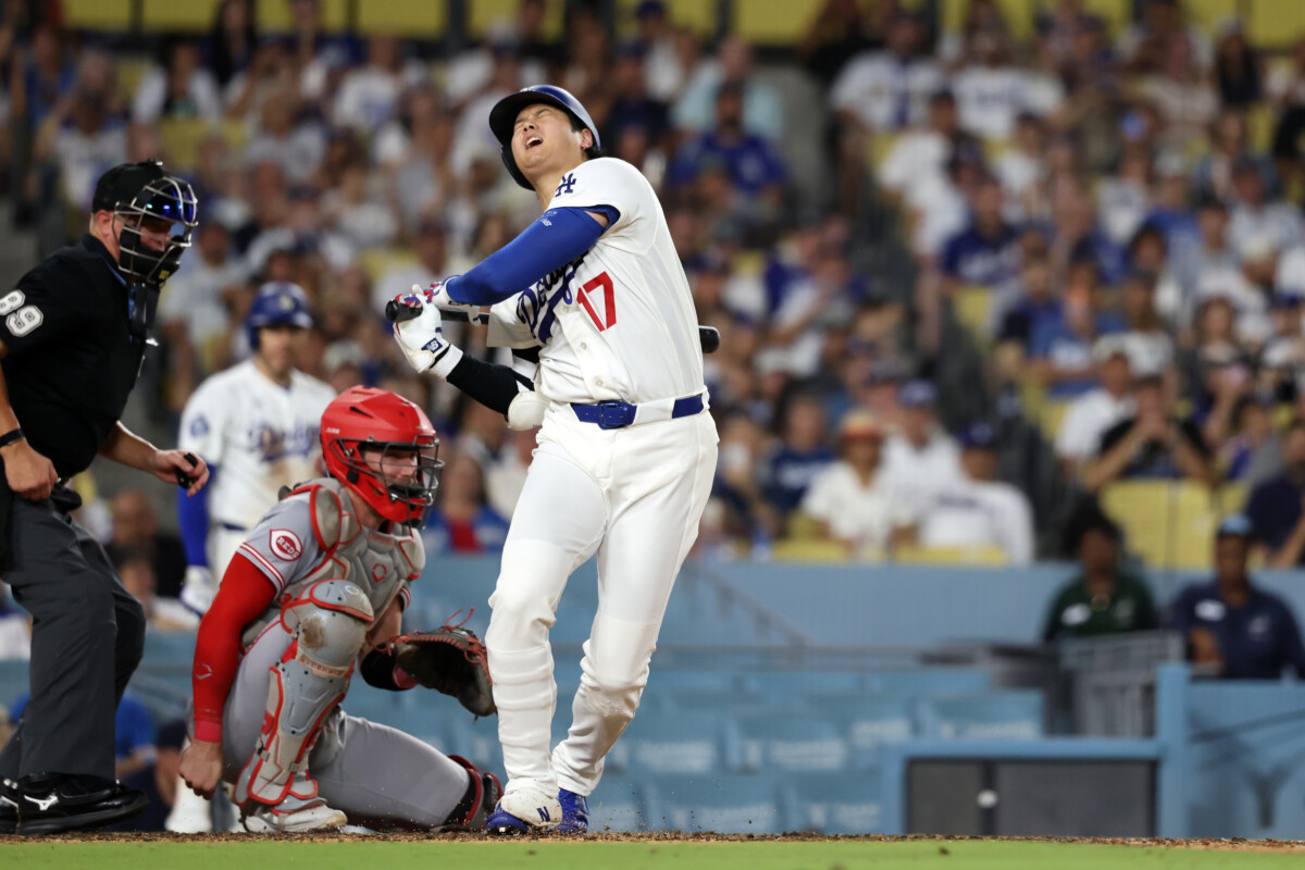Sep 7, 2026; Los Angeles, California, USA; Los Angeles Dodgers designated hitter Shohei Ohtani (17) reacts after fouling a ball off his foot during the seventh inning against the Cincinnati Reds at Dodger Stadium. Mandatory Credit: Kiyoshi Mio-Imagn Images