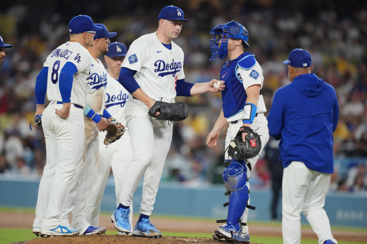 Sep 3, 2026; Los Angeles, California, USA; Los Angeles Dodgers starting pitcher Tarik Skubal (29) extends the ball toward manager Dave Roberts (30) for a pitching change against the St. Louis Cardinals during the sixth inning at Dodger Stadium. Mandatory Credit: Kirby Lee-Imagn Images