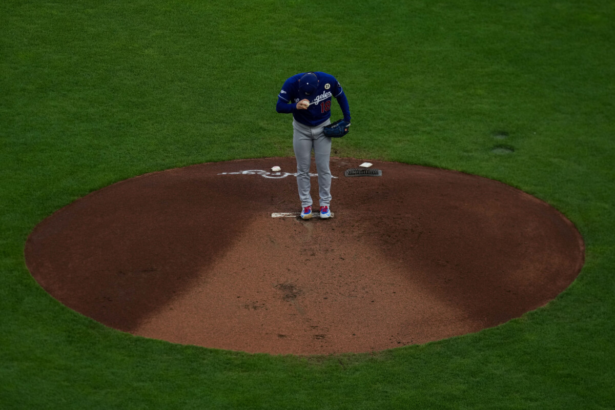 Sep 15, 2026; Cincinnati, Ohio, USA;  Los Angeles Dodgers pitcher Yoshinobu Yamamoto (18) prepares to throw against the Cincinnati Reds in the first inning at Great American Ball Park. Mandatory Credit: Aaron Doster-Imagn Images