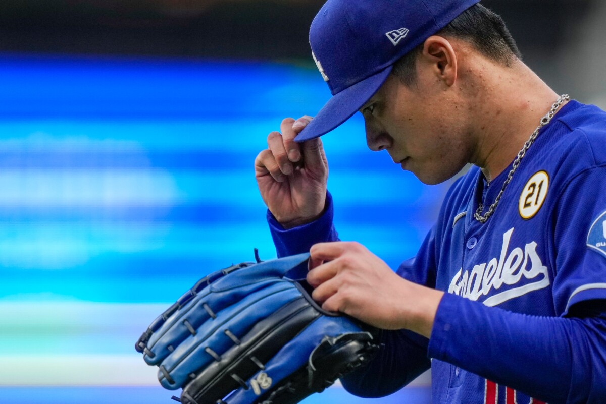 Los Angeles Dodgers pitcher Yoshinobu Yamamoto (18) returns to the dugout after the bottom of the first inning of the MLB National League game between the Cincinnati Reds and the Los Angeles Dodgers at Great American Ball Park in Cincinnati on Tuesday, Sept. 15, 2026. The Dodgers led 3-0 after three innings.