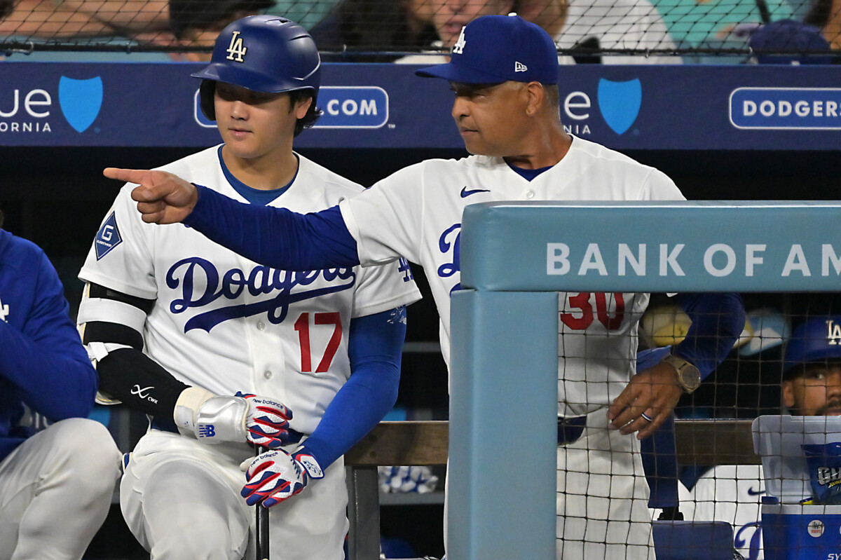 Aug 11, 2026; Los Angeles, California, USA; Los Angeles Dodgers designated hitter Shohei Ohtani (17) talks with manager Dave Roberts (30) on the dugout steps during the seventh inning against the Kansas City Royals at Dodger Stadium. Mandatory Credit: Jayne Kamin-Oncea-Imagn Images