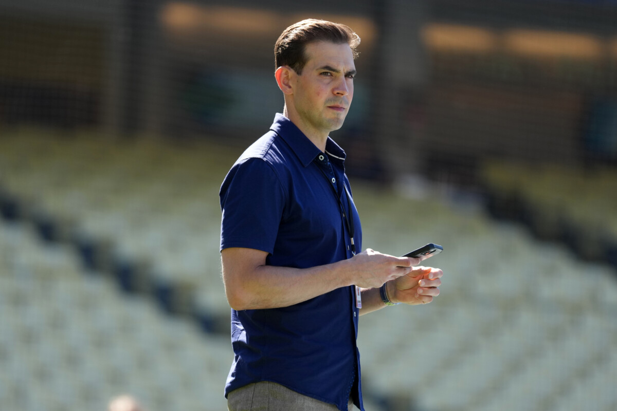 Jun 16, 2026; Los Angeles, California, USA; Spectrum SportsNet LA play-by-play announcer Joe Davis watches batting practice before the game between the Los Angeles Dodgers and the Tampa Bay Rays at Dodger Stadium. Mandatory Credit: Kirby Lee-Imagn Images